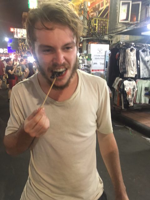 Eating a scorpion from a Bangkok street stall