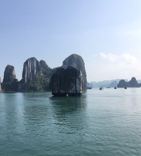Kayaking between the rocks at Ha Long Bay