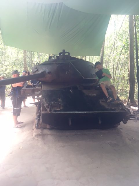 Handling a snake at the Cu Chi tunnels site