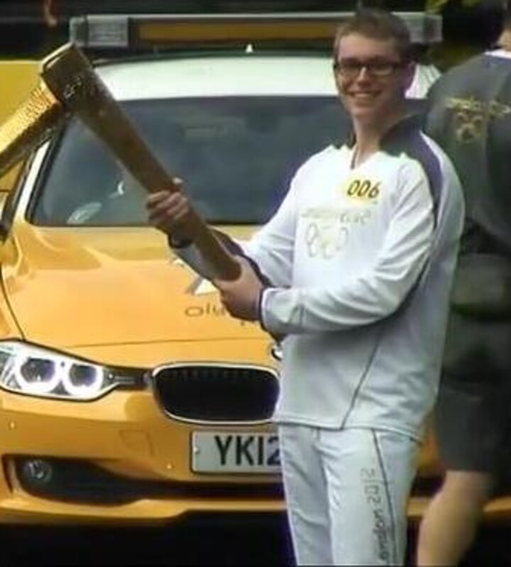 Josh Cox carrying the Olympic torch, London 2012
