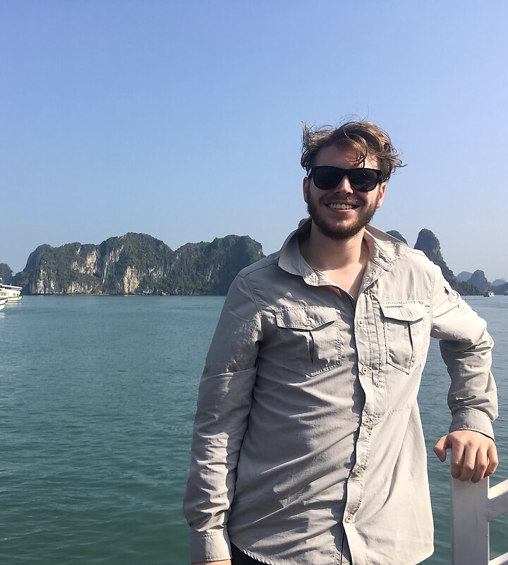 Josh Cox on a boat in Ha Long Bay, Vietnam